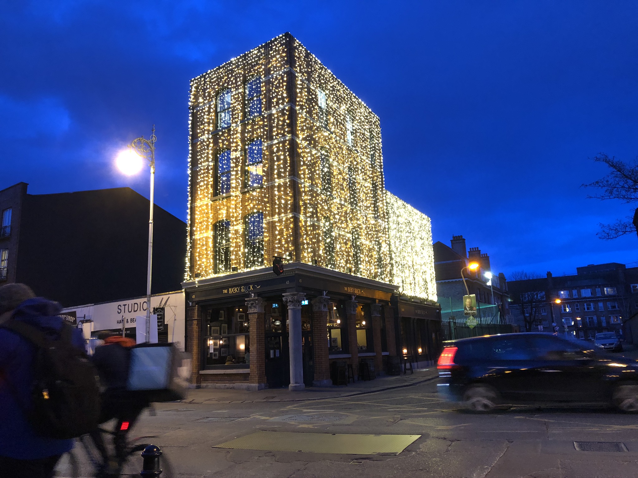 Pub with upper flowers completely covered in Christmas Lighting